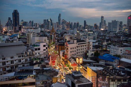 a view on Yaowarat Road in China Town with skyline in City of Bangkok in Thailand.  Thailand, Bangkok, November, 5, 2024.