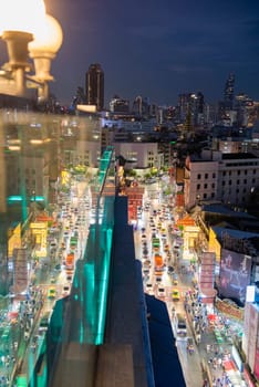 a view on Yaowarat Road in China Town with skyline in City of Bangkok in Thailand.  Thailand, Bangkok, November, 5, 2024.