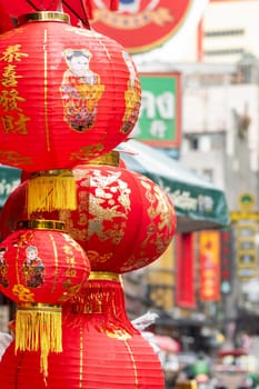 a Market street with shops in the China Town with skyline in the City of Bangkok in Thailand.  Thailand, Bangkok, November, 6, 2024.