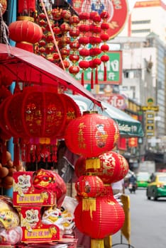 a Market street with shops in the China Town with skyline in the City of Bangkok in Thailand.  Thailand, Bangkok, November, 6, 2024.