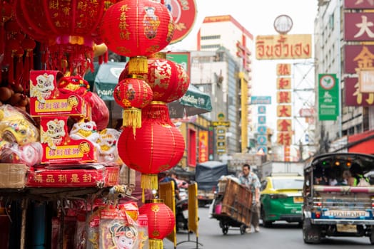 a Market street with shops in the China Town with skyline in the City of Bangkok in Thailand.  Thailand, Bangkok, November, 6, 2024.
