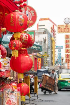 a Market street with shops in the China Town with skyline in the City of Bangkok in Thailand.  Thailand, Bangkok, November, 6, 2024.