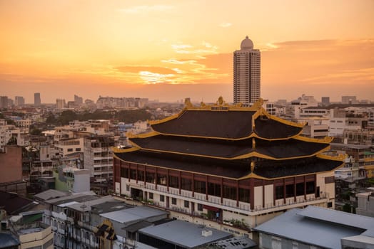 Wat Chaiyaphum Karam in China Town with skyline of City of Bangkok in Thailand.  Thailand, Bangkok, November, 6, 2024.
