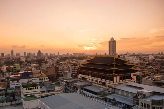 Wat Chaiyaphum Karam in China Town with skyline of City of Bangkok in Thailand.  Thailand, Bangkok, November, 6, 2024.