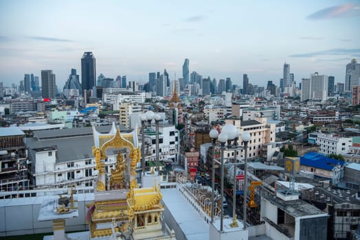 Wat Traimit in Chinatown with skyline in the City of Bangkok in Thailand.  Thailand, Bangkok, November, 6, 2024.