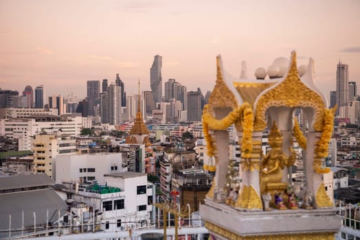 Wat Traimit in Chinatown with skyline in the City of Bangkok in Thailand.  Thailand, Bangkok, November, 6, 2024.