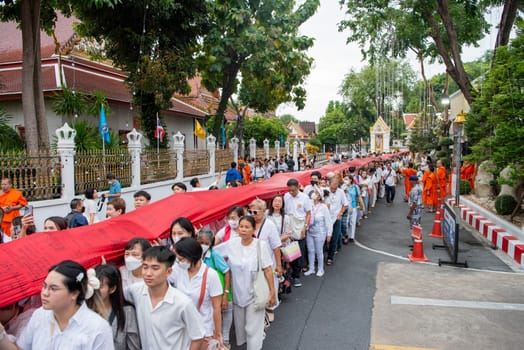 Ceremony on the way to Golden Mount at Wat Saket Festival Fair in Bangkok in Thailand.  Thailand, Bangkok, November, 8, 2024.