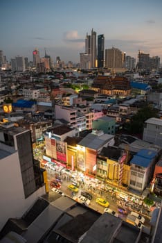 a view on Yaowarat Road in China Town with skyline in City of Bangkok in Thailand.  Thailand, Bangkok, November, 6, 2024.
