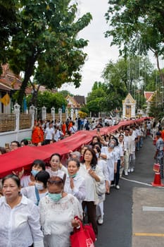 Ceremony on the way to Golden Mount at Wat Saket Festival Fair in Bangkok in Thailand.  Thailand, Bangkok, November, 8, 2024.