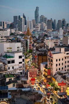 a view on Yaowarat Road in China Town with skyline in City of Bangkok in Thailand.  Thailand, Bangkok, November, 6, 2024.