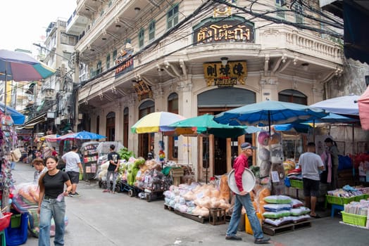 a street with shops and Market the China Town with skyline in the City of Bangkok in Thailand.  Thailand, Bangkok, November, 7, 2024.