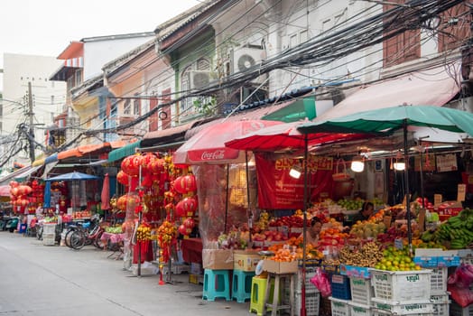 a street with shops and Market the China Town with skyline in the City of Bangkok in Thailand.  Thailand, Bangkok, November, 7, 2024.