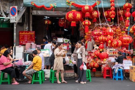 a street with shops and Market the China Town with skyline in the City of Bangkok in Thailand.  Thailand, Bangkok, Dezember, 14, 2024.