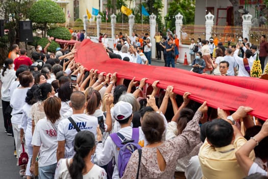 Ceremony on the way to Golden Mount at Wat Saket Festival Fair in Bangkok in Thailand.  Thailand, Bangkok, November, 8, 2024.