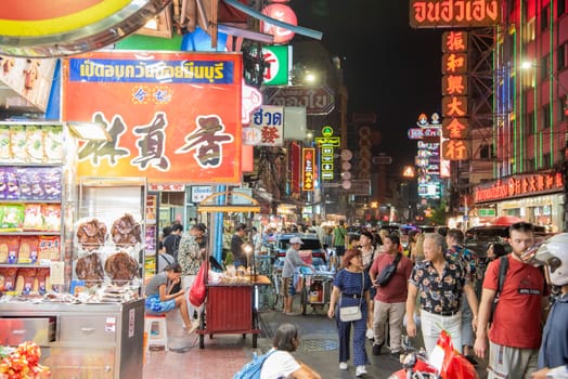 People and shops at Night Streetmarket on Yaowarat Road in Chinatown in City of Bangkok in Thailand.  Thailand, Bangkok, December,14, 2024.