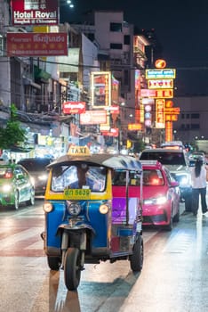 a Tuk Tuk at Marketstreet on Yaowarat Road in Chinatown in City of Bangkok in Thailand.  Thailand, Bangkok, Dezember, 14, 2024.
