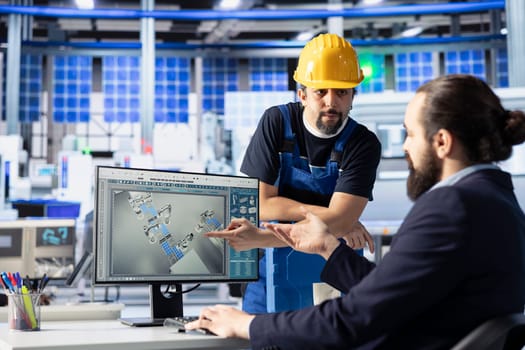 Solar panels plant engineering team talking, brainstorming ways to optimize efficiency after analyzing data. Photovoltaics factory colleagues work together on innovative solar cells design prototype