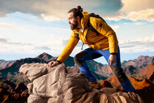 Male trekker takes in the breathtaking mountain landscape on rocks, enjoying the scenic background, crisp air and rugged peaks. Excitement of discovering new horizons for wellbeing.