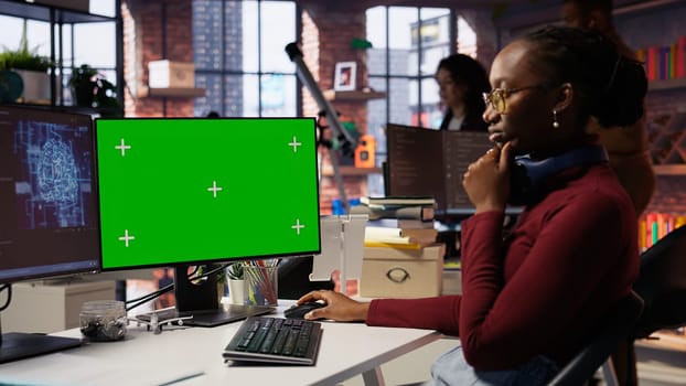 Isolated screen PC in workspace used by AI researcher working with artificial intelligence technology. Mockup computer monitor used by employee developing AI systems in tech startup, camera B