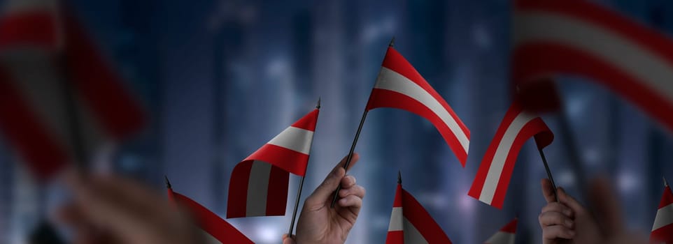 Austria flags in their hands on a blurred urban background. The photo illustration was created without the use of artificial intelligence, only using Photoshop.
