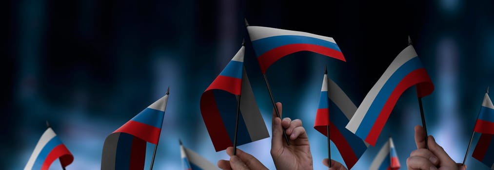 Russia flags in their hands on a blurred urban background. The photo illustration was created without the use of artificial intelligence, only using Photoshop.