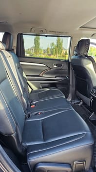 Discover the spacious and luxurious second-row seating of this SUV, designed for family trips and comfort. Enjoy a smooth ride and ample legroom for a delightful travel experience.
