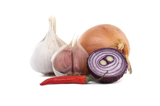 A collection of fresh cooking ingredients including garlic, onion, a sliced purple onion, and a red chili pepper. Perfect for recipes, cooking concepts, and food presentations showcasing natural ingredients.