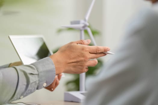 A business consultant engages in an ESG discussion, showcasing strategies for sustainability and governance.