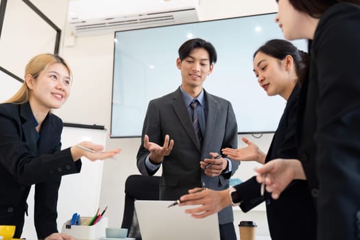 A business meeting where team members exchange ideas and strategies, focusing on project updates and collaborative efforts for success.