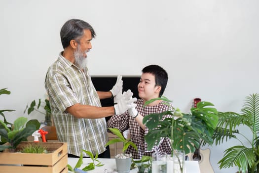 An elderly man and his grandson engage in gardening, promoting sustainability and environmental awareness while enjoying quality time together.