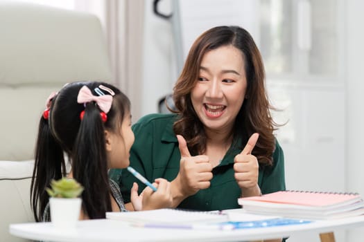 A mother and her daughter share a joyful moment while preparing for school, highlighting the excitement of learning and bonding over education.