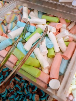 Colorful candy assortment at market sweets shop stall, candy store, fruit jelly candies. High quality photo