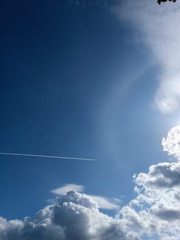 Blue sky background with clouds sun and plain print summer sunny day. High quality photo