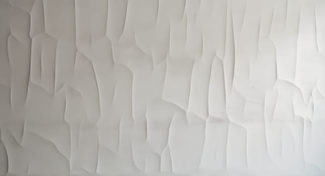 White wall with a pattern resembling streamlined crumpled paper. Created using AI Generated technology and image editing software.