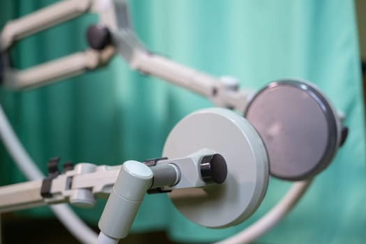 Top down view of a person using a rehabilitation machine for leg therapy, focusing on muscle training and mobility.