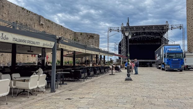 Budva, Montenegro - May 21, 2025: Outdoor stage is being prepared for summer tourist season opening ceremony event