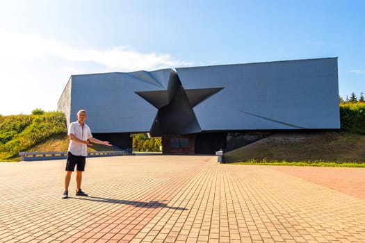 Man handsome tourist at the Brest Fortress star gate Brestskaya Krepost Zvezda in Leninskiy Rayon Brest Brest District Brest Region Belarus.