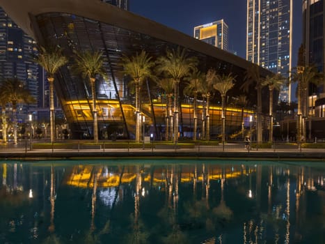 Dubai, UAE, 26 September 2024: Night view of the Dubai Opera near the Burj Khalifa Tower at night. High quality photo
