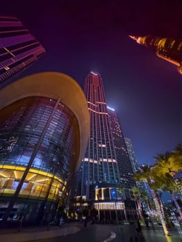 Dubai, UAE, 26 September 2024: Night view of the Dubai Opera near the Burj Khalifa Tower at night. High quality photo
