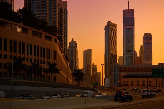 UAE, Dubai, 19 September 2024: architecture of the city at sunset, skyscrapers with glass facades. High quality photo