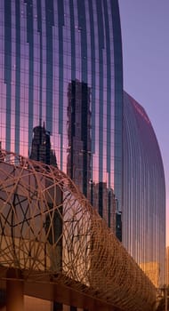 UAE, Dubai, 19 September 2024: architecture of the city at sunset, skyscrapers with glass facades. High quality photo