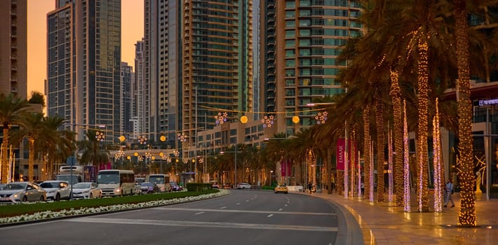 UAE, Dubai, 19 September 2024: architecture of the city at sunset, skyscrapers with glass facades. High quality photo