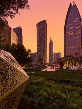 UAE, Dubai, 19 September 2024: architecture of the city at sunset, skyscrapers with glass facades. High quality photo