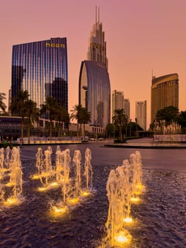 UAE, Dubai, 19 September 2024: architecture of the city at sunset, skyscrapers with glass facades. High quality photo