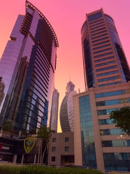 UAE, Dubai, 19 September 2024: architecture of the city at sunset, skyscrapers with glass facades. High quality photo