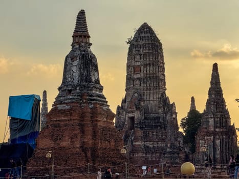 Bangkok, Thailand - November 11, 2024: Tourist visiting Wat Maha That Buddhist temple, peaceful sacred place with ancient construction. Historical Thai landmark for historic culture.