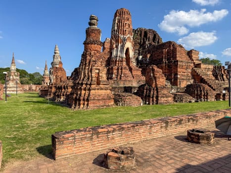 Historic Buddhist Wat Maha That temple with brick walls in Thailand, famous religious site with ancient architecture represents spiritual heritage and cultural exploration. Buddhism faith.