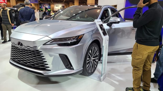 Toronto, ON Canada - 02.19.2023: Sleek Silver Lexus SUV on Display at Auto Show, Modern Design and Innovative Features, Automobile.