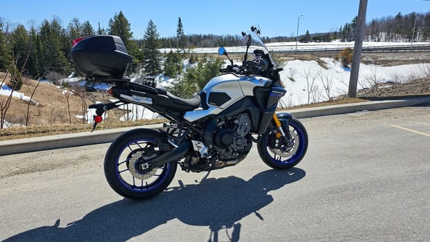 Ottawa, ON Canada - 04.09.2023: Touring Machine A Modern Adventure Yamaha Tracer 9 GT Motorcycle Ready for the Open Road. Gray Asphalt.