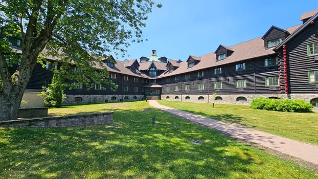 Ottawa, ON Canada - 06.04.2023: Grand Lodge Exterior with Lush Green Lawn and Pathway on a Sunny Day, Architectural Splendor.